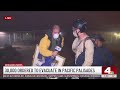 NBC4's Robert Kovacik helps Palisades Fire evacuee.mp4