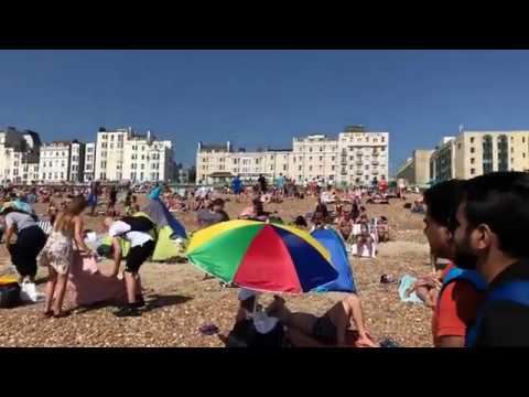 Crowded Brighton Beach, UK during summer 2019 | 4K video