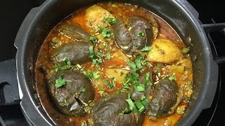 Pressure Cooker Ringan Ravaiya | Stuffed Baby Eggplant Curry Video Recipe