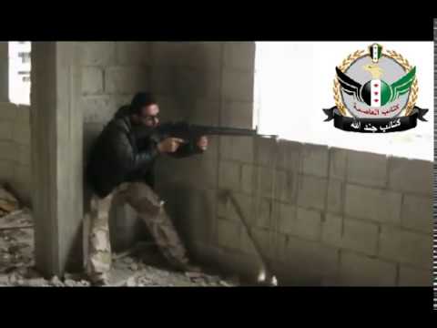 تأمين قناصي كتائب جند الله التغطية النارية لمقاتلي الجيش الحر أثناء اقتحام كتيبة الدفاع الجوي قرب مدينة الحجر الأسود في ريف دمشق ضمن معركة "أخبرنا الرسول أنه في محرم"