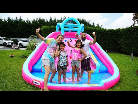 Family fun playing with Inflatable water slide