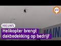 Bedrijf zet heli in voor nieuwe dakbedekking