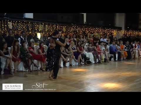  Gioia Abballe  and  Simone Facchini  are  dancing  to  the  vals  "  Dichas Que Vivi  "  by  Rodolfo Biagi  at  Singapore International Tango Festival  in  2017