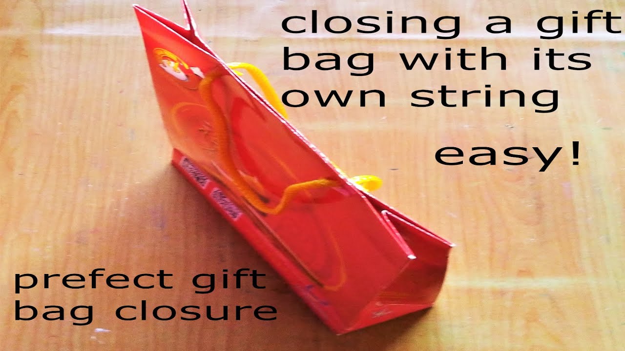 easy! closing a gift bag with its own string/ perfect gift bag closure/close gift bag with handles