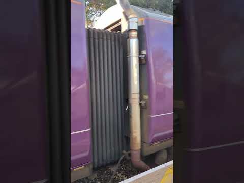 Class 170 leaves Beeston station with a lot of thrash