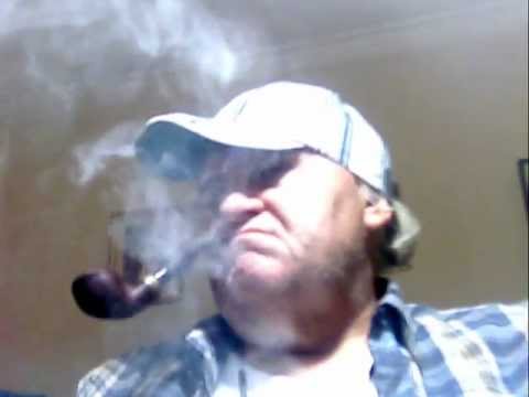 Smoker, of Peterson' s Dublin, Sterling, Silver, Pipe Tobaccos, with Scotland Hat; in Monday