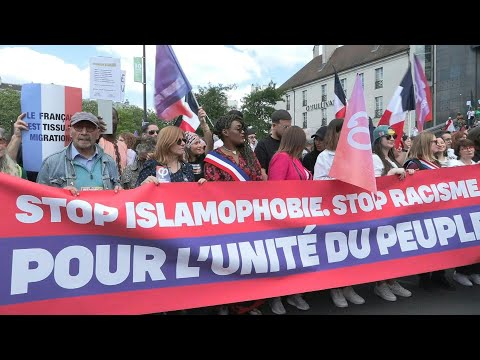 Thousands march in Paris against Islamophobia after mosque killing | AFP