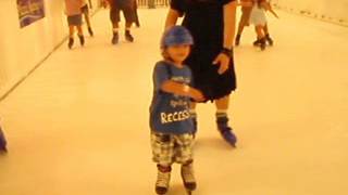 Little Boy Skating with prosthesis