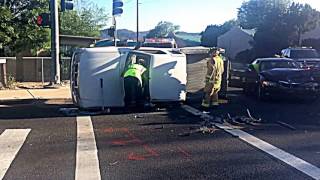 Firefighters rescue dog from overturned car