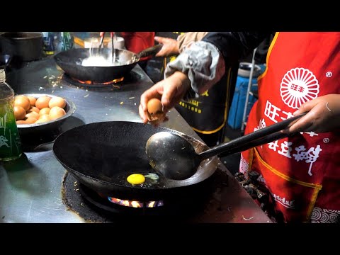 Chinese street food- Couples team up with egg fried rice fried noodles,  fried chicken bones