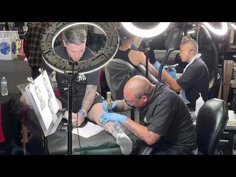 Seaside Tattoo Show includes tattoo artists at work