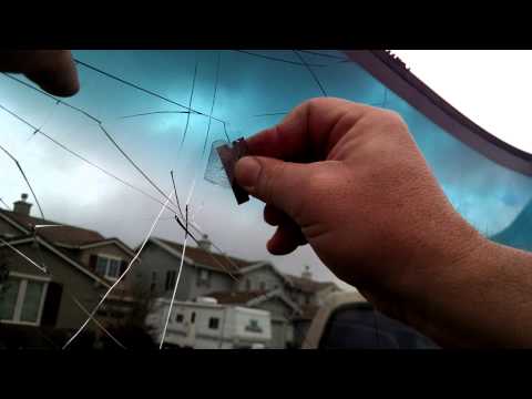 Part of a video titled How to Remove Rear View Mirror Glue From A Windshield - YouTube