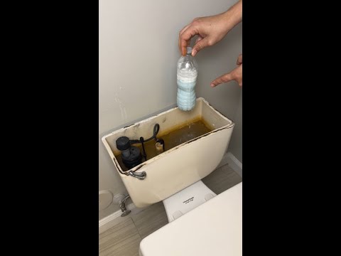 Part of a video titled I Put a Bottle in My Toilet Tank… The Results Were Shocking! - YouTube