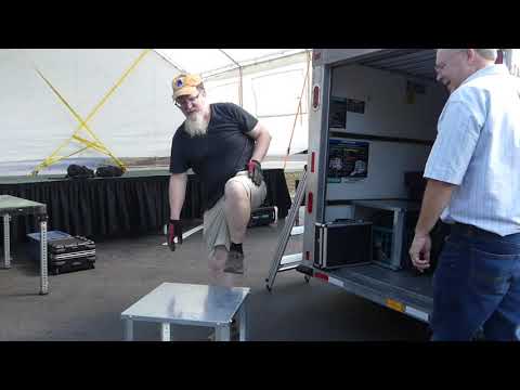 Assisting a local band with their sound system setup and mixing for an event - Video 30