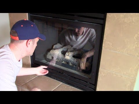 How open & remove to clean the glass cover on a GAS FIREPLACE