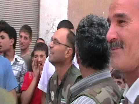 مرافقة العقيد مالك كردية عند زيارته إلى حلب