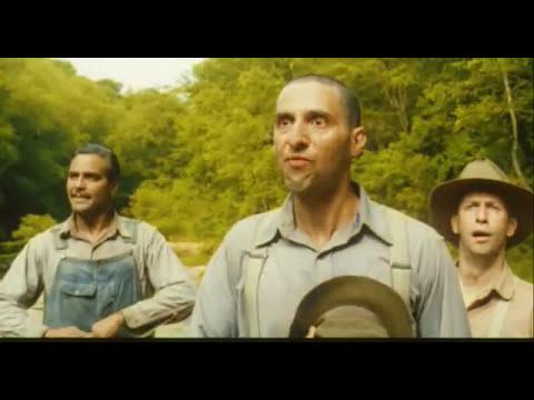 O Brother, Where Art Thou? trailer still with the three escaped convicts walking through a field