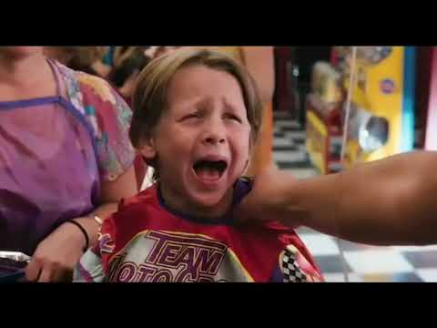 Trailer montage still of Zohan dancing in a club booth as the crowd reacts