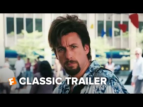 Trailer still: Zohan struts through NYC streets, headphones on, as neon titles pop