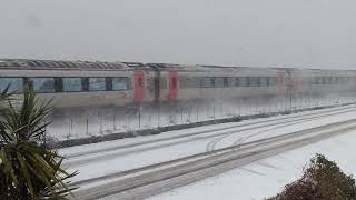 preview picture of video 'Cross country voyager passing Starcross Devon in the snow on the Riviera Line'