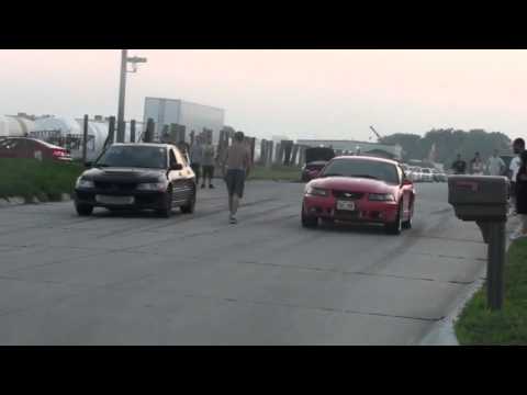 Evan's Mitsubishi Evo 8 tuned by Mellon Racing 600awhp vs Mustangs