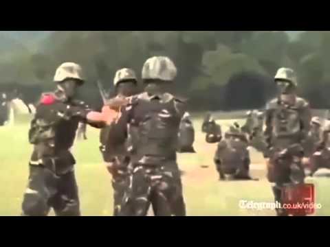 Chinese soldiers play hot potato with live bomb!
