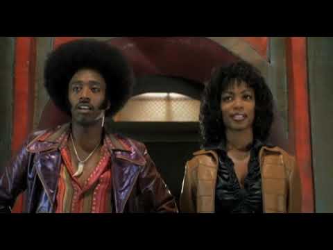 End-card style trailer frame — afro pick silhouette over bold colors, echoing the theme’s horn tag