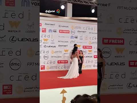 رانيا يوسف وزجها يرتديان الأبيض في ختام مهرجان القاهرة السينمائي