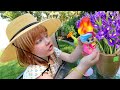 BACKYARD FLOWER SURPRiSE!!  Adley helps water the garden, petal pets, blume babies (mystery package)