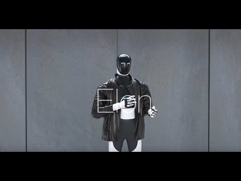 職場で一緒に座っているコンピューターを持つ人間とロボット