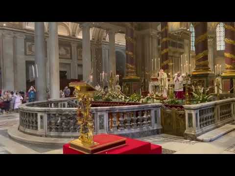 White rose petals descend from the ceiling during a Solemn Mass at Rome’s Basilica of St. Mary Major