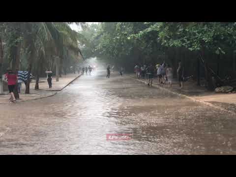 Tourists playing in flood street in Mexico