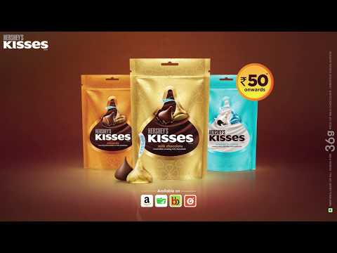 Dropping delicious Hershey's KISSES Milk Chocolate