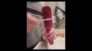 Quick, easy, 100% effective way to remove lint balls from hair brush, w/out damaging the bristles!