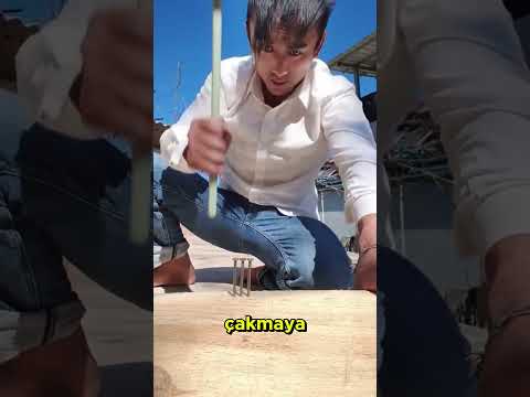 This man has an exceptional skill at hammering nails.