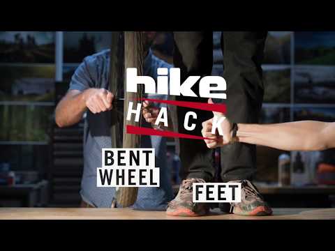 Part of a video titled Bike Hacks: Bent Wheel Field Fix - YouTube