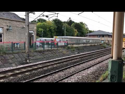 DRS 37558 and 37218 passing Carnforth station on the mainline on spraying duties