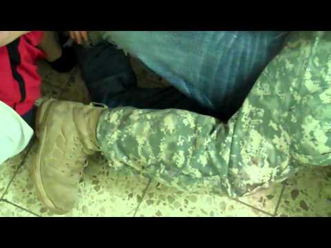 Barracks Life. Taping up the new guy