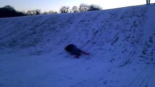 Carly rolling down a hill.