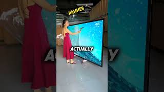 She is trying to break an unbreakable TV screen