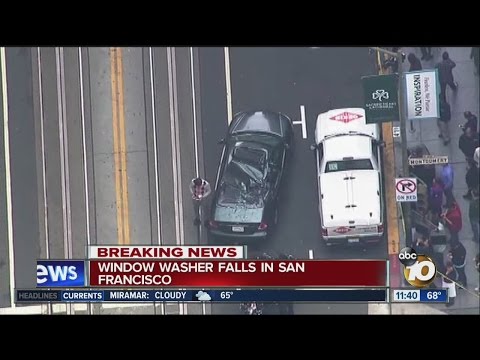 Window washer survives 11-story fall onto car