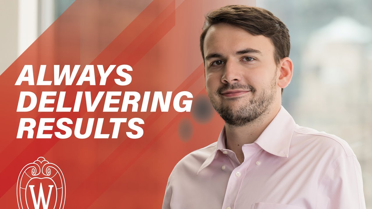 Young man with brown hair wearing pink dress shirt, text says "Always Delivering Results"