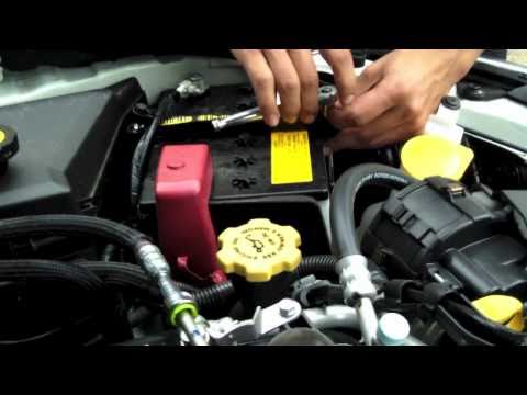 Kartboy Battery Tie Down & Oil Cap on a Subaru WRX.