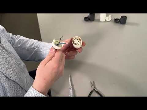Part of a video titled How To Use Lampfix ES Continental Snap Together Lampholder
