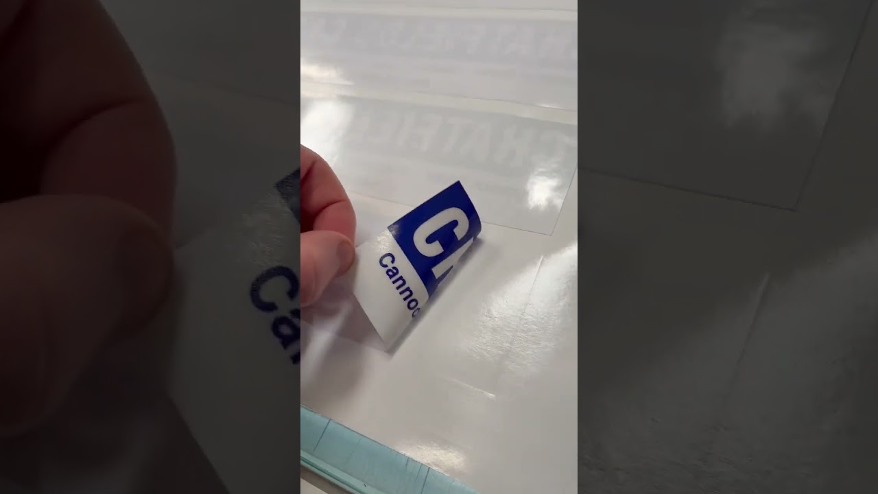 Reverse printed, white backed window stickers ready to be cut and packed.