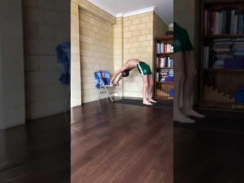 Backbend with hands on the chair