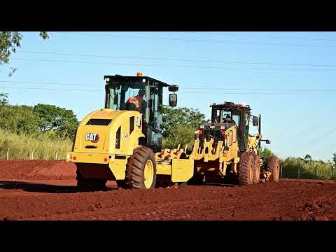 Cat CP7 Padfoot Vibratory Soil Compactor Working Behind a Cat Motor Grader