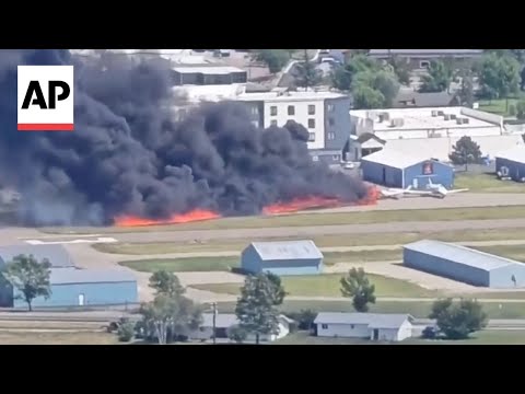 Plane crashes into parked aircraft while landing at Montana airport, sparking fire