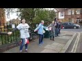 Human chain around Carnegie Library Herne Hill