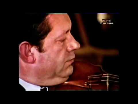 Arthur Grumiaux testing a violin